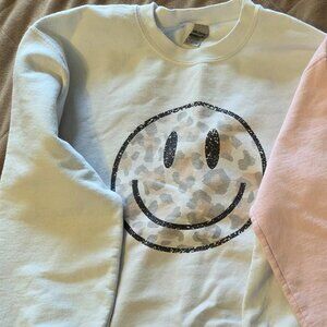 White smiley sweatshirt